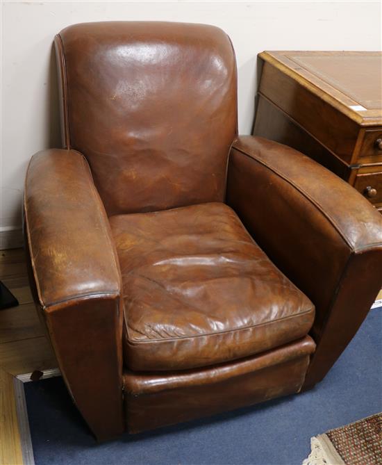 A pair of 1940s leather club armchairs